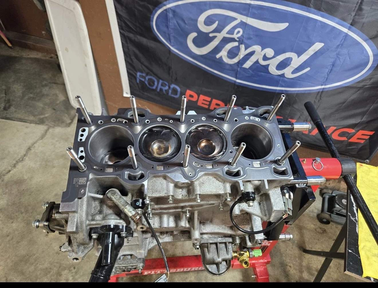 Engine block and pistons during assembly